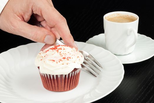 Picking Up Fork To Eat Red Velvet Cupcake with Espresso