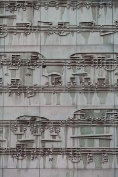 Musical sheet on a facade of a building