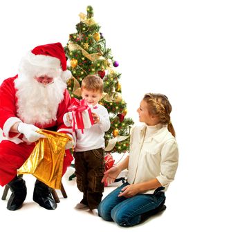 Santa Claus giving Christmas Gifts to Children. Christmas Scene 