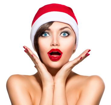 Christmas Woman. Beauty Model Girl in Santa Hat over White
