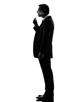 business man smoking electronic e-cigarette silhouette