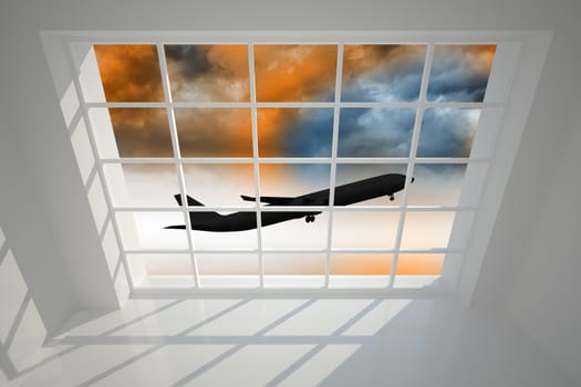 Airplane flying over orange sky past window