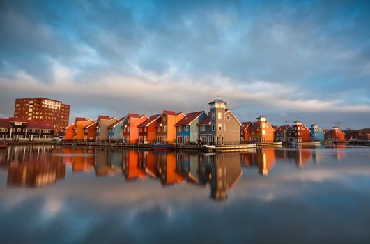 colorful buildings on water during sunrise, Holland