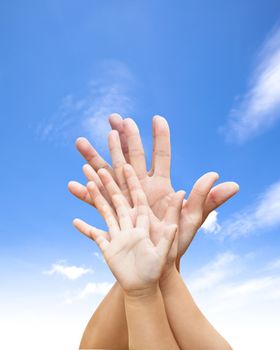 family united hands with blue sky and cloud 