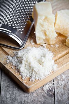 grated parmesan cheese and metal grater