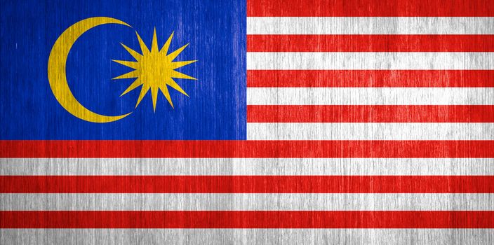 Malaysia Flag on wood background
