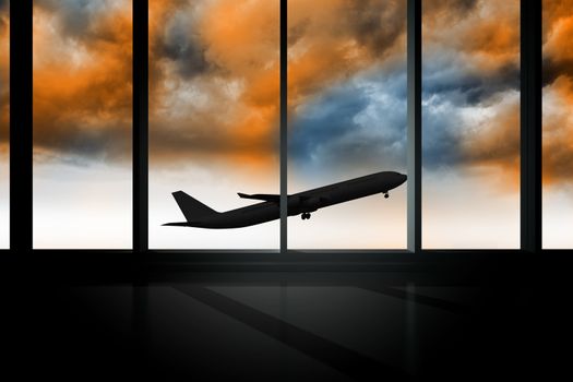 Airplane flying past window in orange sky