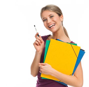 Young student smiling, holding folders and pen, isolated on white