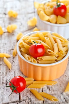uncooked pasta and cherry tomatoes