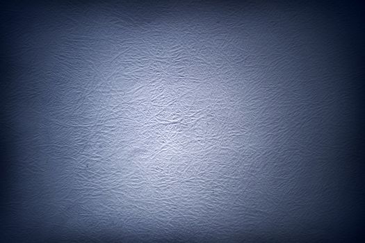 Blue textured surface, dark edges