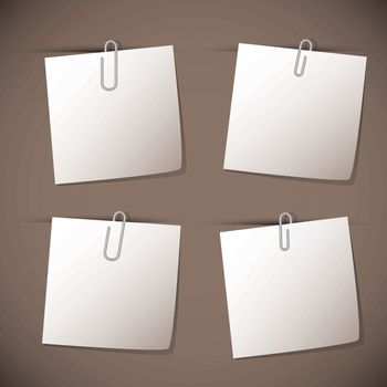 Note papers with paperclip on brown background