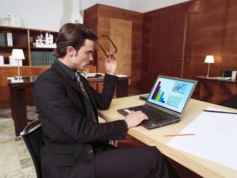 businessman with laptop in office l