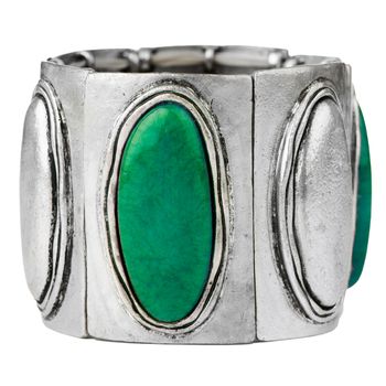 Silver bracelet with green gemstones