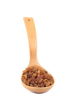 Wooden spoon with raisins.