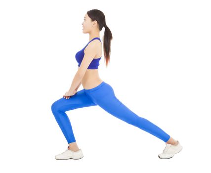 young sporty woman doing warm exercise