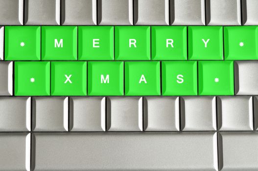 Merry Xmas spelled on a metallic keyboard