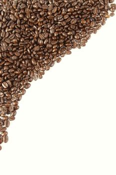 Closeup of coffee beans on plain background. Copy space