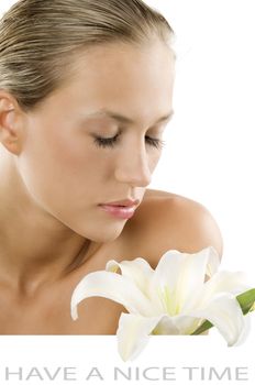 fresh portrait of a young and beautiful woman smelling a white flower with white space for text