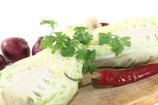 sweetheart Cabbage with hot peppers on a board