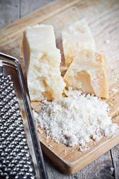 grated parmesan cheese and metal grater 