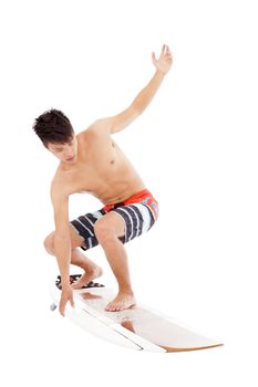 young  surfer make a  surfing pose
