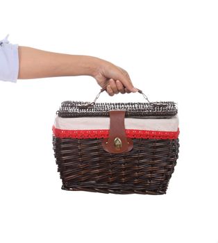 hand with weave wicker basket bag