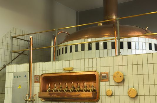 Mash tun and wort siphoning valves in brewery.