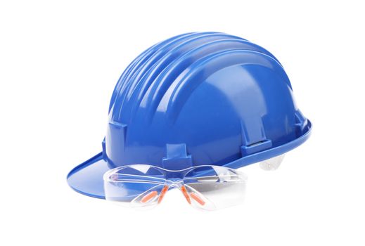 Hard hat with a pair of safety glasses.