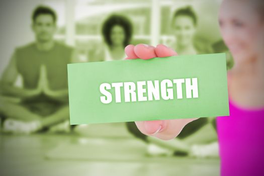 Fit blonde holding card saying strength