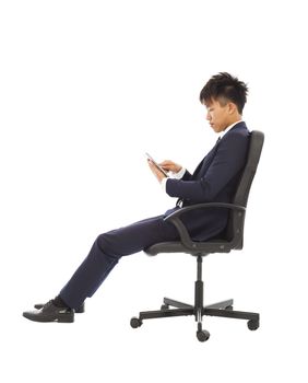 businessman using tablet pc on the chair