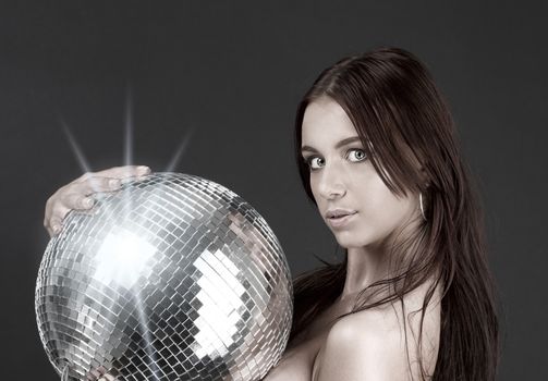 beautiful naked woman with disco ball
