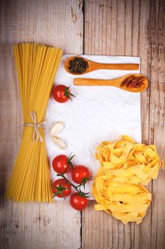 uncooked pasta with tomatoes and spices