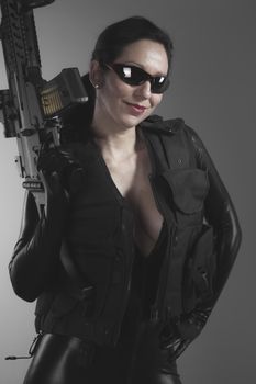 Costume, Brunette woman with enormous bulletproof vest and gun