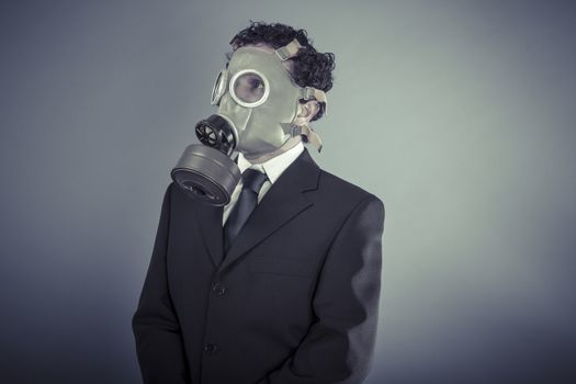 Industry, Business man wearing a gask mask, pollution concept
