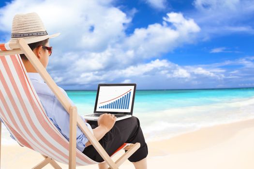 businessman sitting on beach chairs and look stock financial