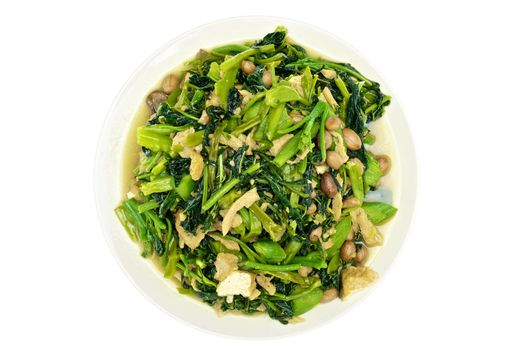 Morning glory and spinach fried with groundnut vegetarian food isolated