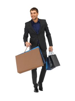 handsome man in suit with shopping bags