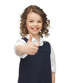 pre-teen girl showing thumbs up
