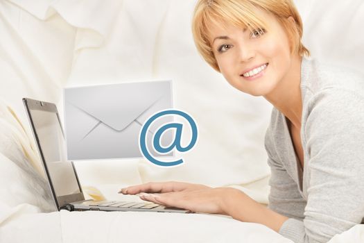 woman with laptop computer sending e-mail