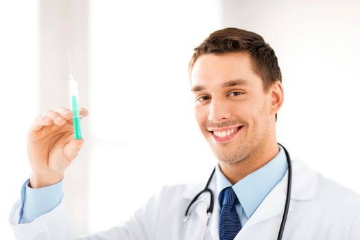 male doctor holding syringe with injection