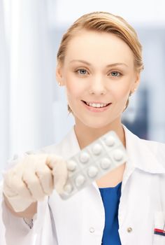 doctor with blister pack of pills