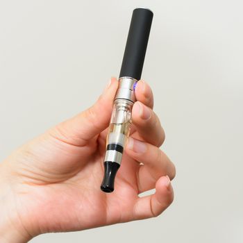 electronic cigarette in hand