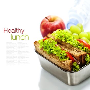 Lunch box with sandwiches and fruits