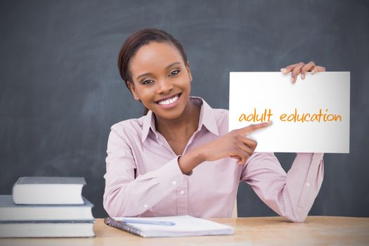 Happy teacher holding page showing adult education
