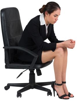 Worried businesswoman on swivel chair