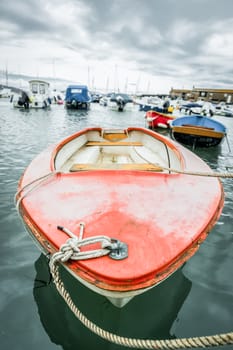abstract of a small boat in a busy harbor