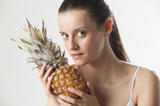 young woman with an pineapple