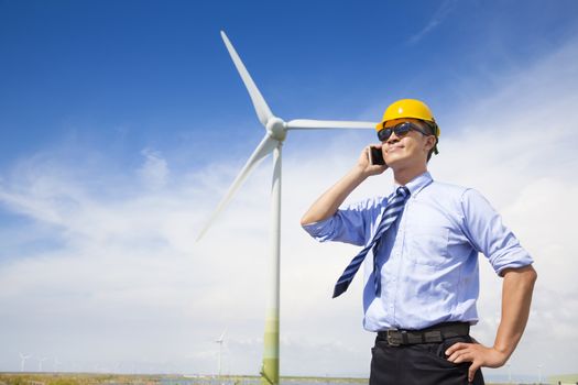professional business standing with wind generator 