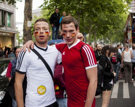 Gay couple dressed as football players.
