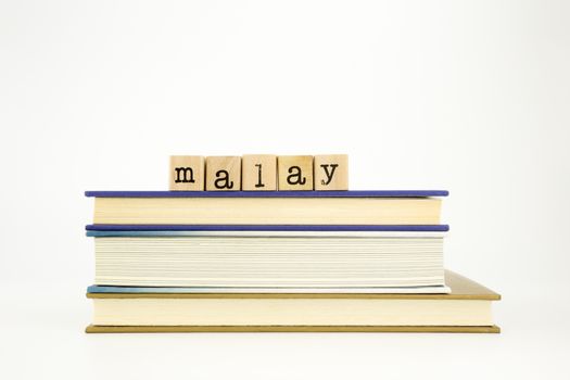 malay language word on wood stamps and books